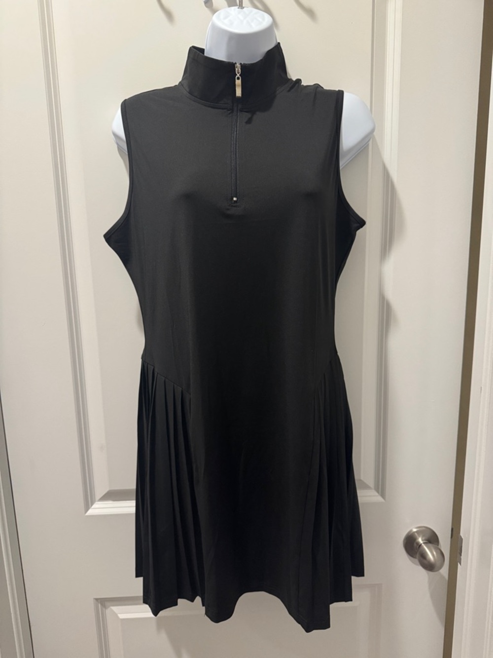 Sleeveless Black Mock-Neck Mini Dress with Side Pleats